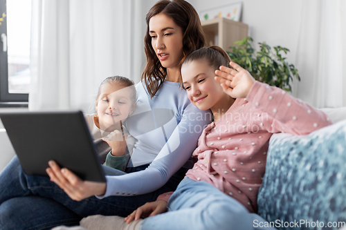 Image of mother and children having video call on tablet pc