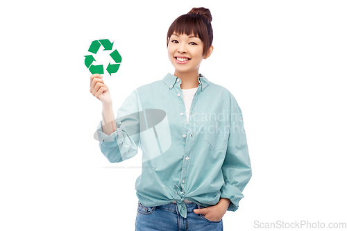 Image of smiling asian woman holding green recycling sign