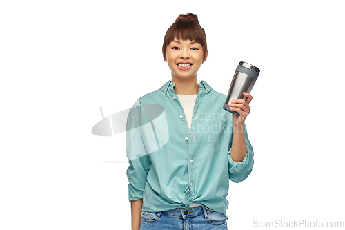 Image of woman with thermo cup or tumbler for hot drinks