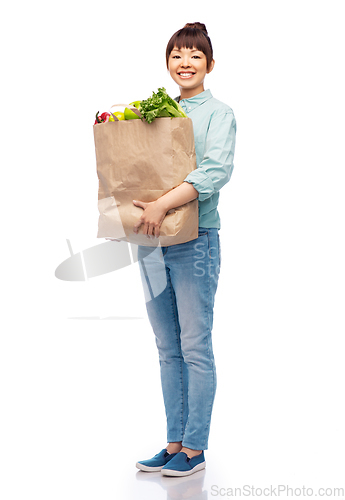 Image of happy smiling asian woman with food in paper bag