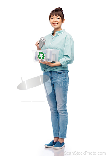 Image of smiling young asian woman sorting metallic waste