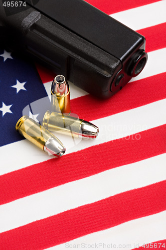 Image of gun and bullets on flag