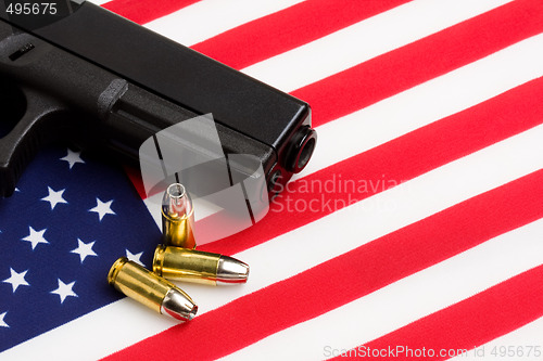 Image of gun over american flag