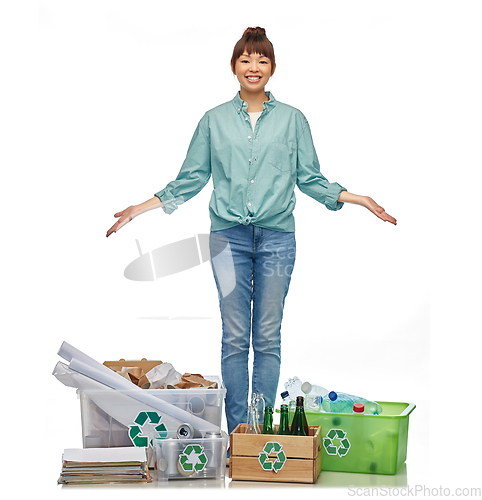 Image of happy woman sorting paper, metal and plastic waste