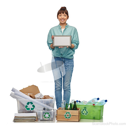 Image of smiling asian woman with tablet pc sorting waste