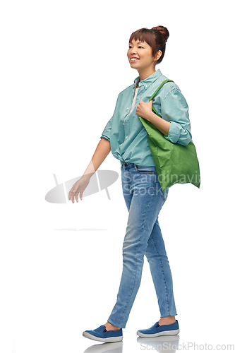 Image of woman with reusable canvas bag for food shopping