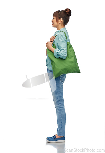 Image of woman with reusable canvas bag for food shopping