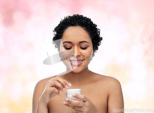 Image of young african american woman with moisturizer