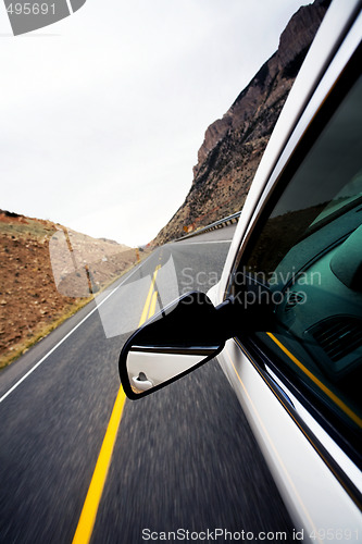 Image of car travel through mountains