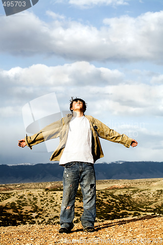 Image of freedom - teen with arms with open