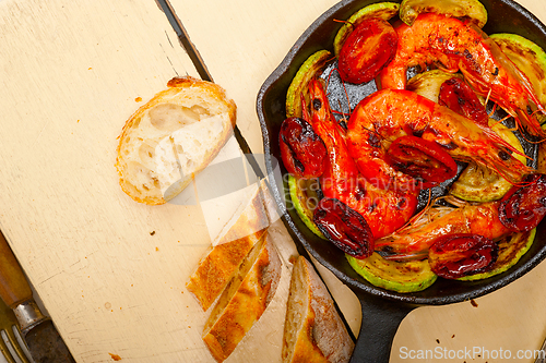 Image of roasted shrimps with zucchini and tomatoes