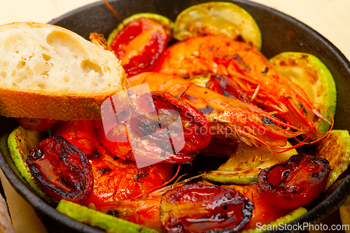 Image of roasted shrimps with zucchini and tomatoes
