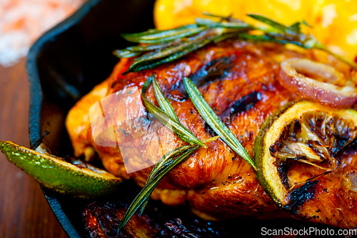 Image of roasted grilled BBQ chicken breast with herbs and spices