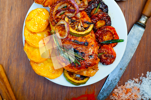 Image of roasted grilled BBQ chicken breast with herbs and spices