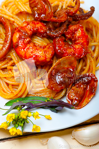 Image of Italian seafood spaghetti pasta on red tomato sauce