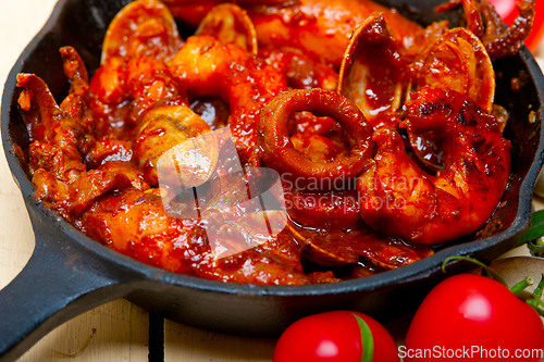 Image of fresh seafoos stew on an iron skillet