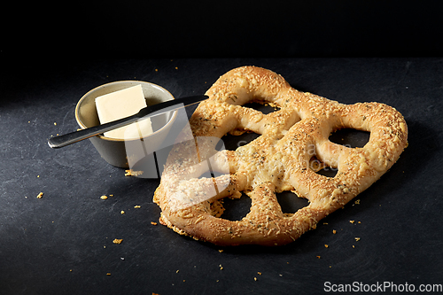 Image of close up of cheese bread, butter and table knife