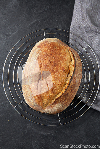 Image of homemade craft bread on stand on table