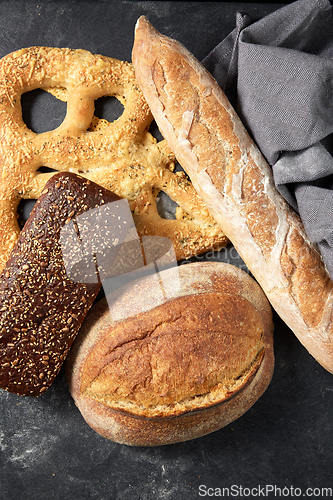 Image of close up of different bread on kitchen towel