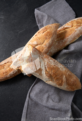 Image of close up of baguette bread on kitchen towel