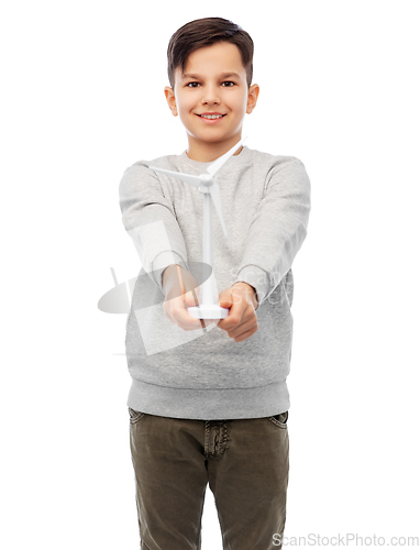 Image of smiling boy with toy wind turbine