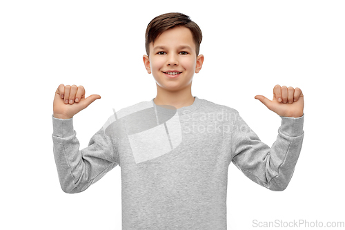 Image of happy smiling boy pointing fingers at himself