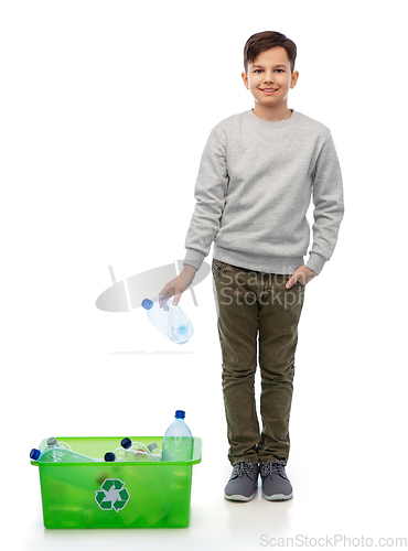 Image of smiling boy sorting plastic waste