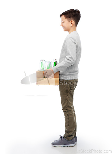 Image of smiling boy with wooden box sorting glass waste