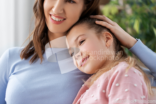 Image of happy smiling mother with daughter at home