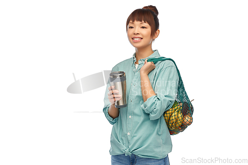 Image of woman with thermo cup or tumbler for hot drinks