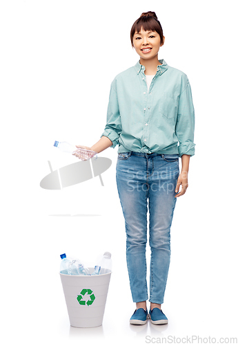 Image of smiling young woman sorting plastic waste