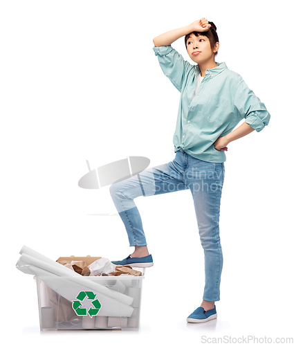 Image of tired asian woman sorting paper waste