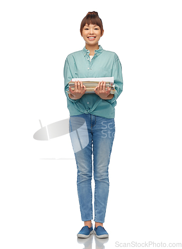 Image of smiling young asian woman sorting paper waste