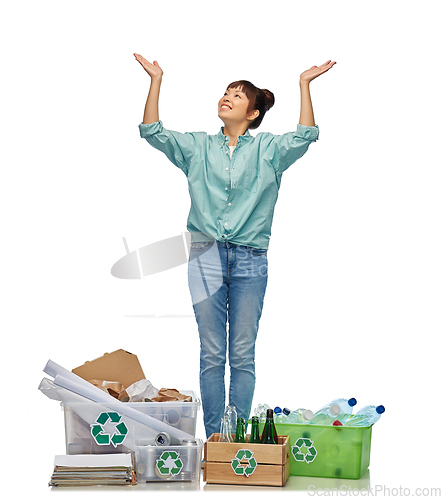 Image of happy woman sorting paper, metal and plastic waste