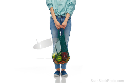 Image of asian woman with food in reusable string bag