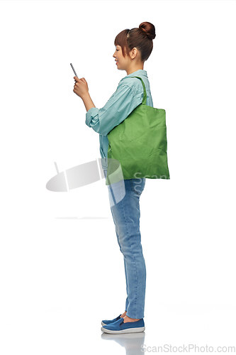 Image of woman with phone and reusable food shopping bag