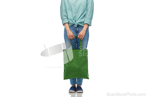 Image of woman with reusable canvas bag for food shopping