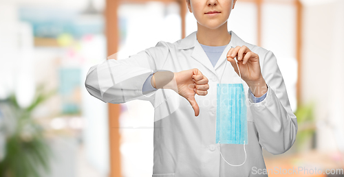 Image of female doctor with mask showing thumbs down