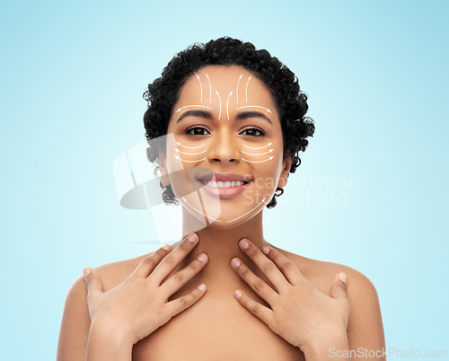 Image of young african american woman with arrows on face