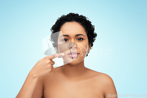 Image of young african american woman with arrows on face