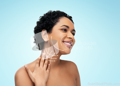 Image of young african american woman with arrows on face