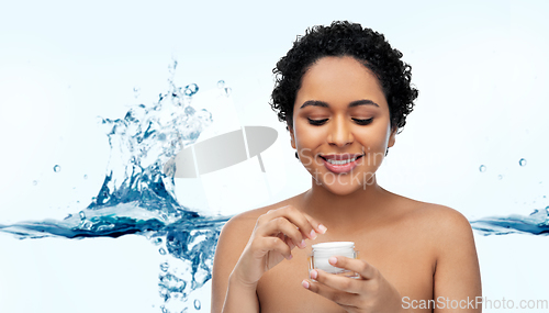 Image of young african american woman with moisturizer