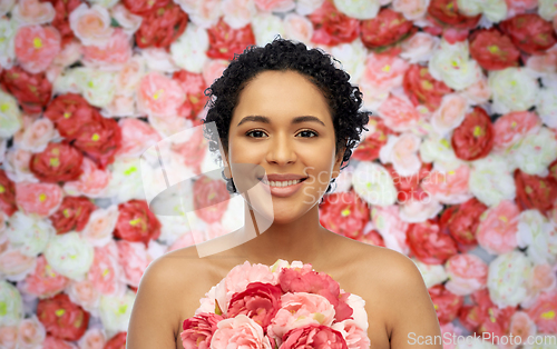 Image of portrait of african american woman with flowers