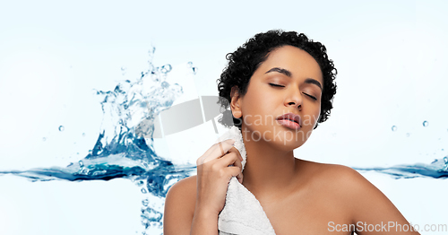 Image of young african american woman with bath towel