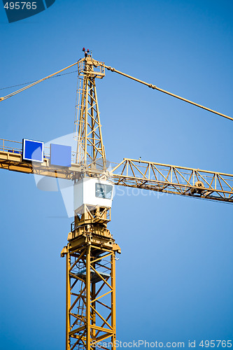 Image of crane tower against blue sky