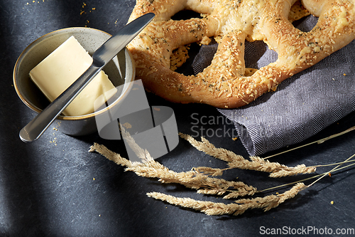 Image of close up of cheese bread, butter and table knife