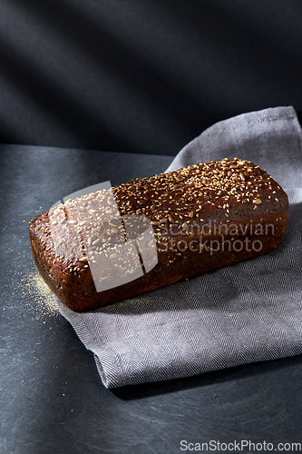 Image of homemade craft bread with seeds on table