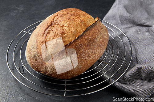 Image of homemade craft bread on stand on table