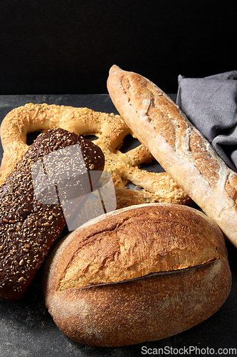 Image of close up of different bread on kitchen towel