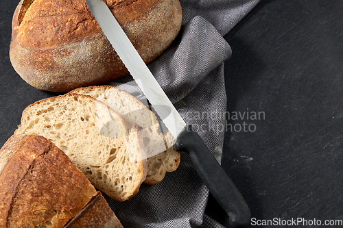 Image of homemade craft bread with kitchen knife